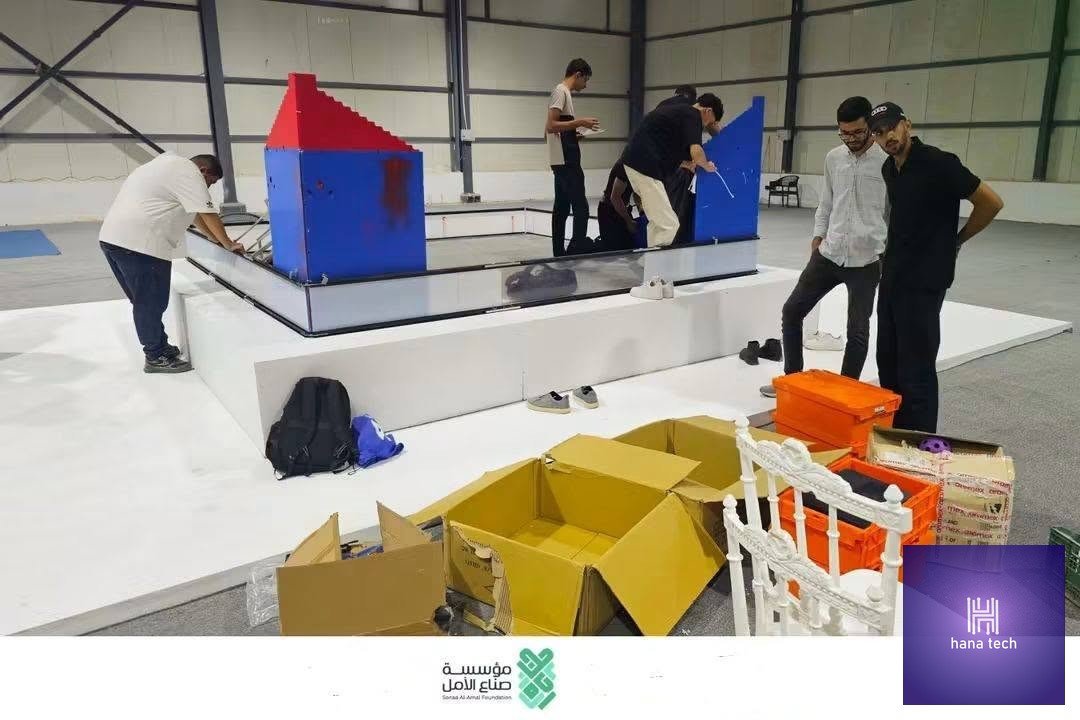Students assembling VEX robotics competition arena