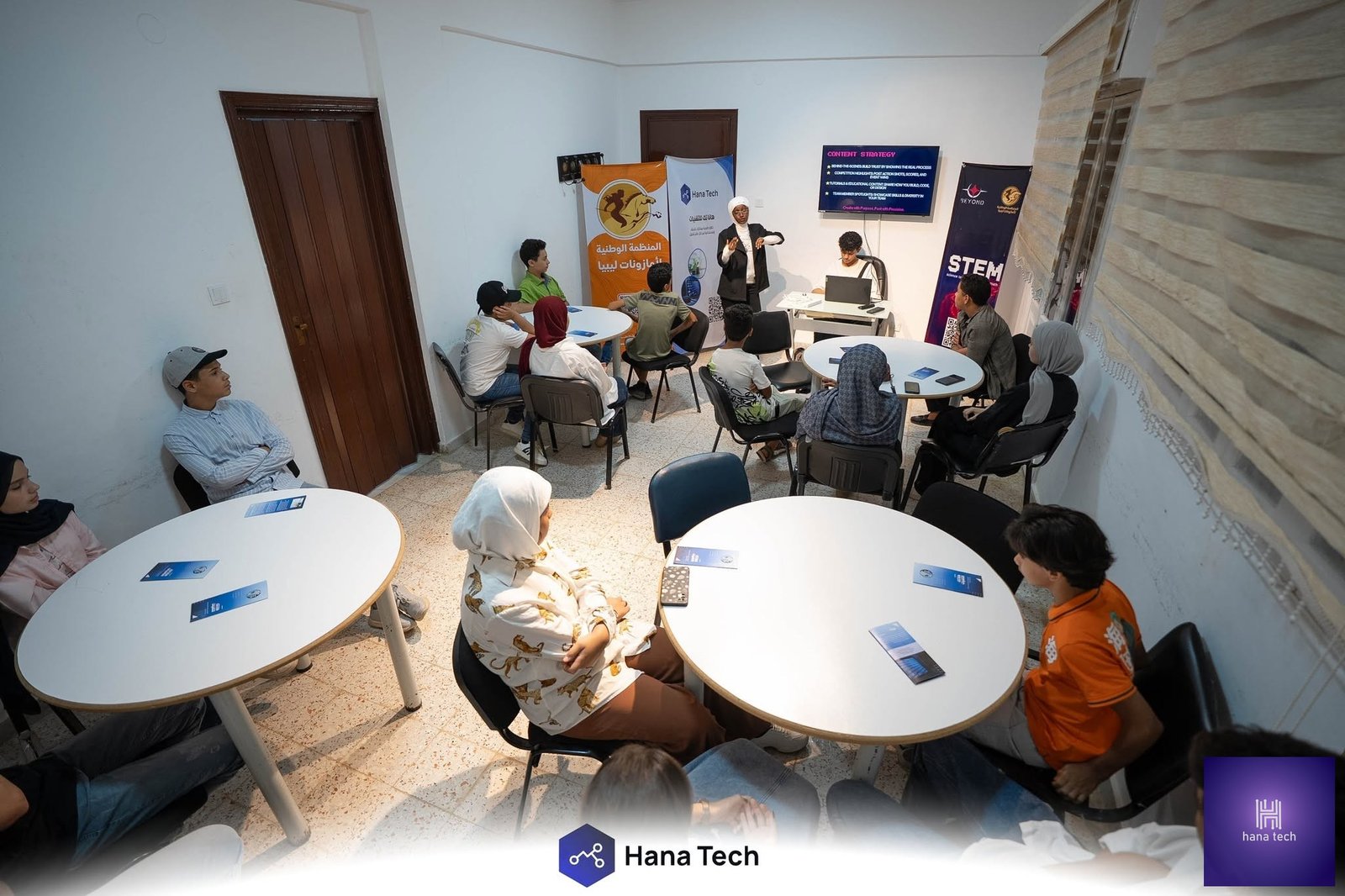 Students receiving certificates after completing Hana Tech robotics training program Libya